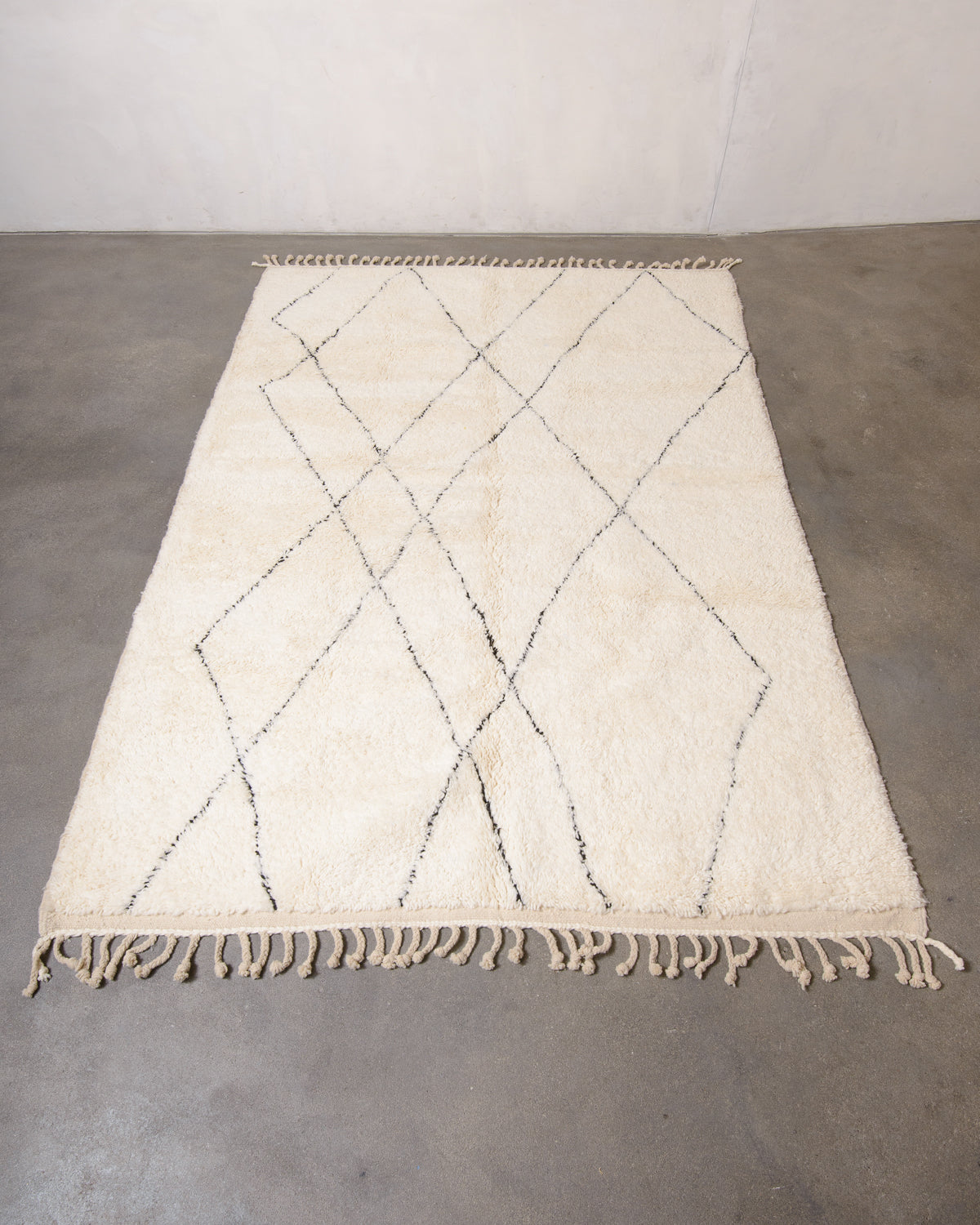 Modern, designer, handcrafted Berber rug from Morocco. Beniourain carpet with minimalist design, natural wool pile and a fluffy texture.